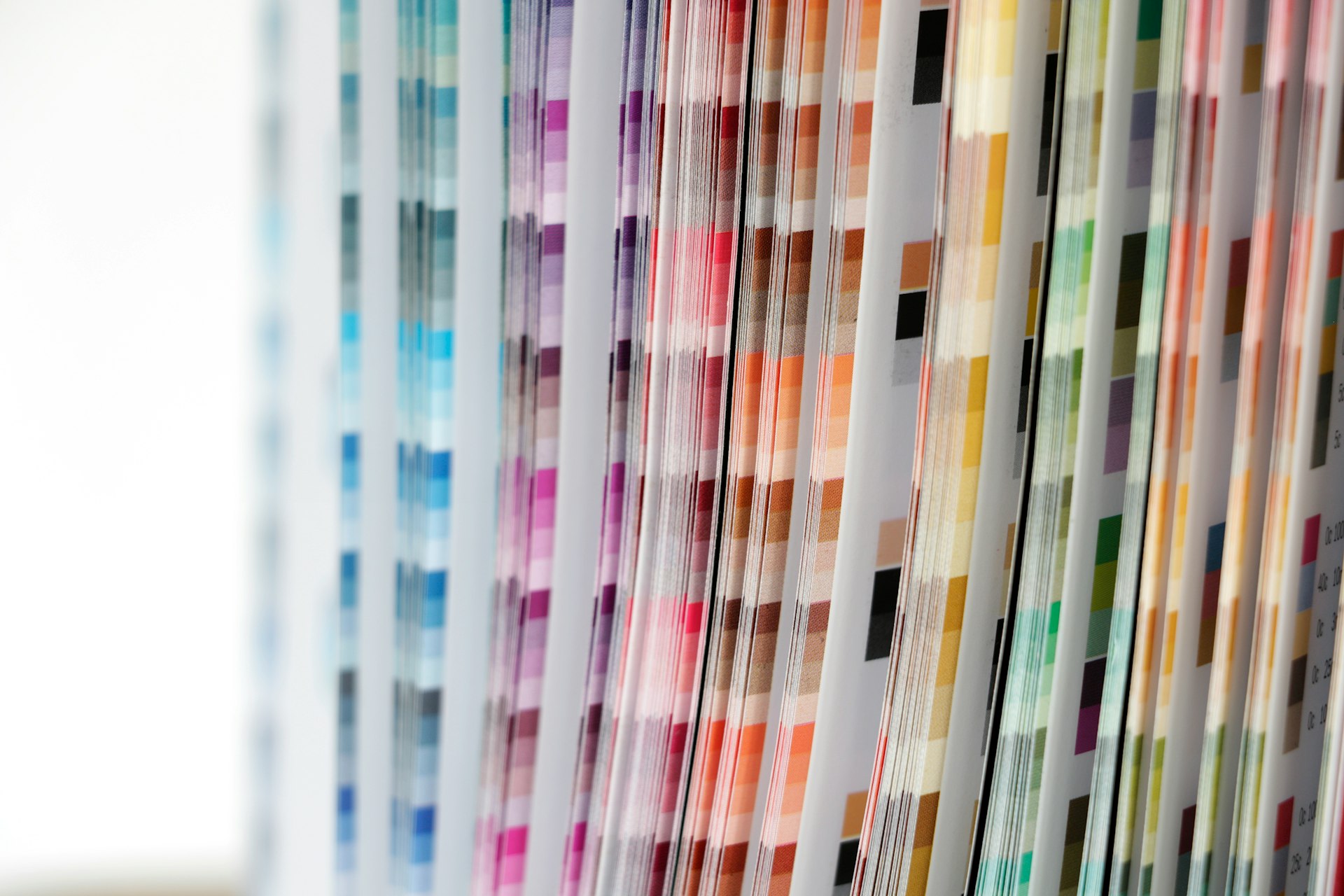 a close up of a number of different colored papers